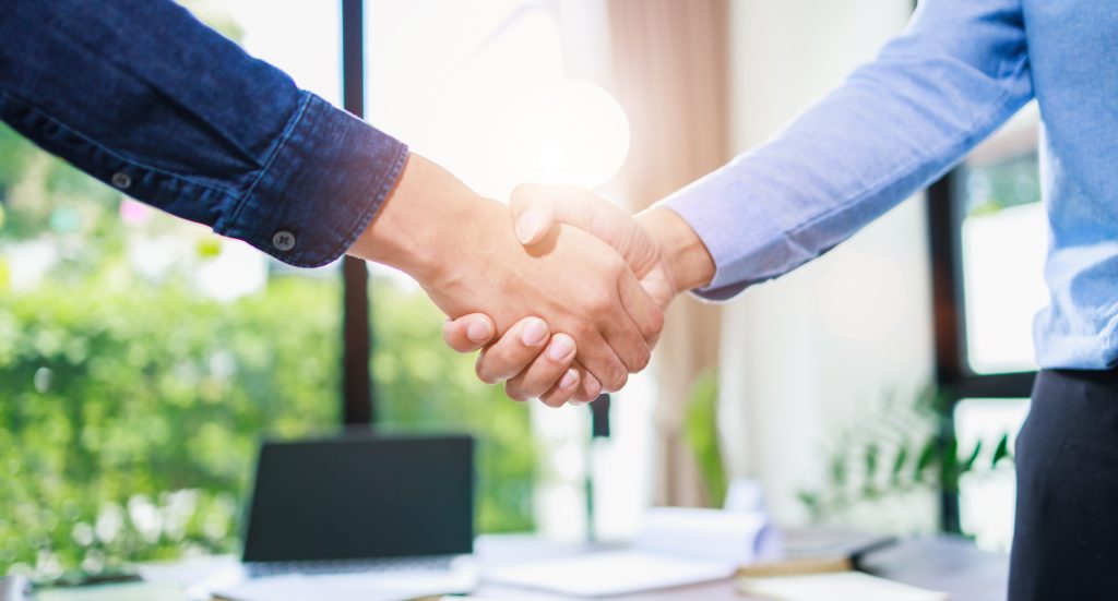 business partnership handshake concept. Successful deal after great meeting.